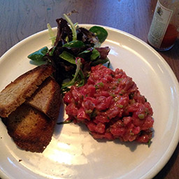 Beer tartare with herb salad and sourdough toast