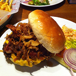 Punisher burger with onion strings